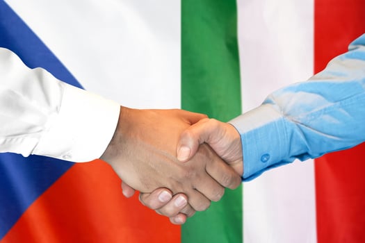handshake on Czech Republic and Italy flag background. photo