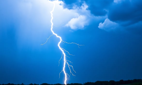 Lightning strike over dark stormy sky, nature background, weather, power photo