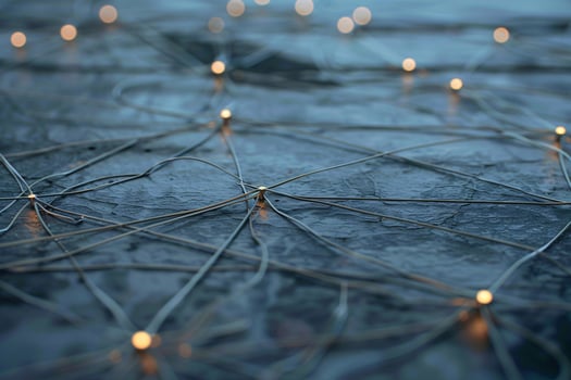 Intricate network of illuminated wires on a dark textured surface, creating a captivating visual effect. photo