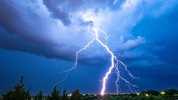 Lightning strike over city at night dramatic weather photo