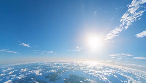 Aerial view sunlit cloudscape over coastal land photo