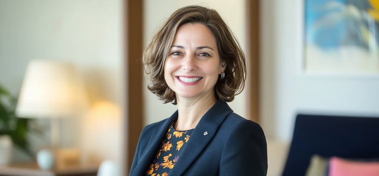 Smiling woman portrait, hotel lobby, blurred background, professional headshot photo