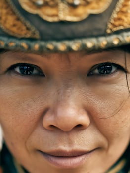 Close Up Portrait of a Woman Wearing Traditional Headwear. A detailed image focusing on the eyes and face of a person in cultural attire. photo