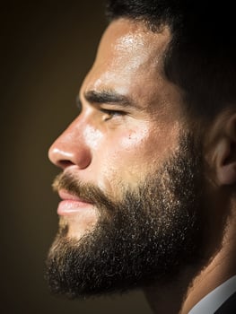 Close up Profile of a Man with a Full Beard, Pensive Expression. photo