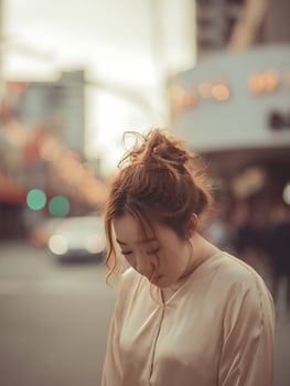 Pensive Woman in City Setting, Close Up Portrait. photo