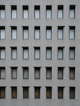 Architectural Photograph of a Modern Building's Facade with Regularly Spaced Windows. photo