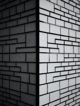 Abstract Black and White Brick Wall Corner A Geometric Architectural Design. photo