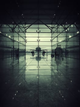 Airplane in Modern Hangar A Dramatic Reflection. photo