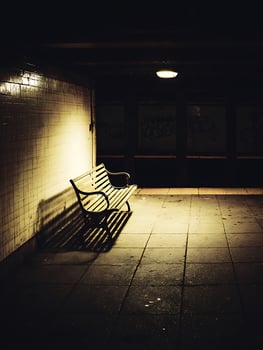 Lonely Bench at Night A Moody Illumination in an Urban Underpass. photo