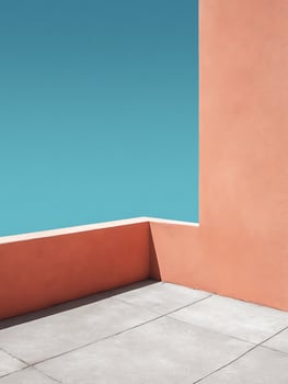 Minimalist Architectural Corner with Coral Wall and Blue Sky. A clean, modern image showcasing geometric shapes and color contrast. photo