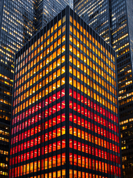 Illuminated Office Building at Night A Modern Architectural Perspective. photo