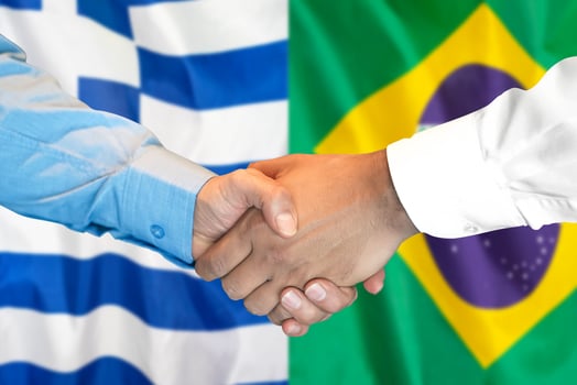 handshake on Greece and Brazil flag background. photo