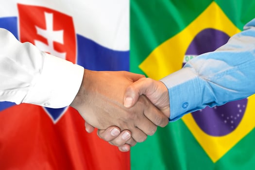 handshake on Slovakia and Brazil flag background. photo