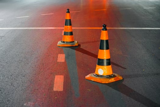 Road cone on the asphalt at night photo