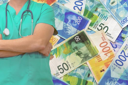 Male surgeon or doctor with stethoscope on the background of the stack of Israeli money notes photo