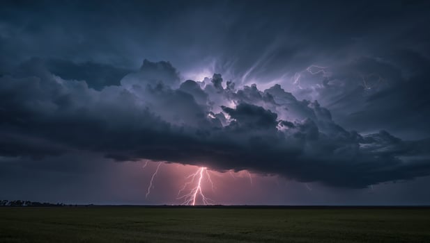 Lightning striking dark storm clouds photo