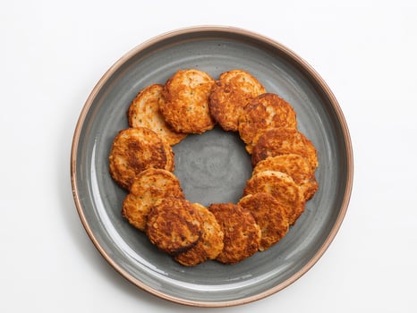 Stack of golden potato pancakes photo