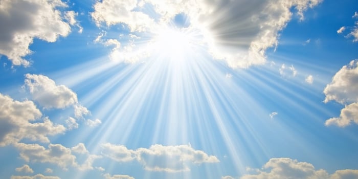 Sunbeams through clouds, bright sky, peaceful day photo