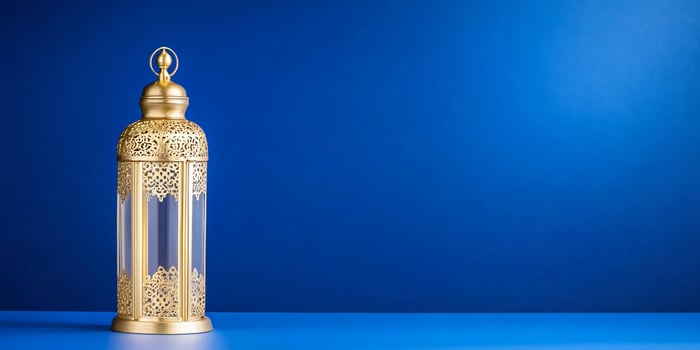 Golden Ramadan lantern on blue background photo