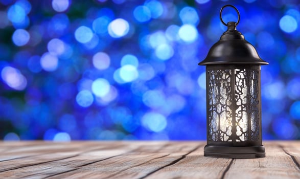 Festive lantern on wooden table, blue bokeh background, Ramadan photo