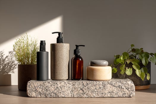 Natural skincare products on granite slab with plants styled in elegant modern design for beauty and lifestyle photo