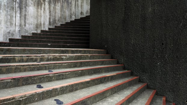 Concrete Staircase with Red Edges and Textured Wall Urban Architecture Background photo