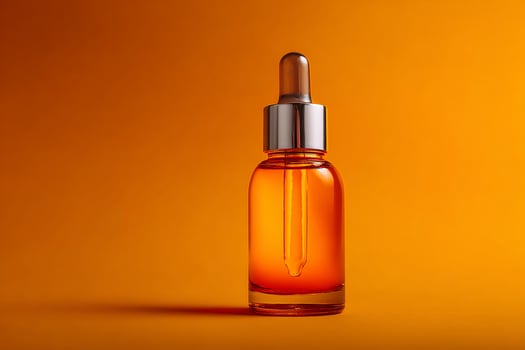 Orange glass bottle with vitamin C serum showcasing organic beauty and minimalist facial care design photo