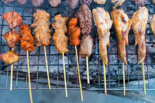 Grilled food is sold on the walking street. photo