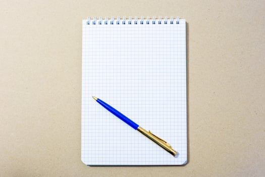 notebook and ballpoint pen photo