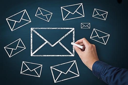 Email marketing strategy concept drawing email icons with chalk on blackboard for business communication photo