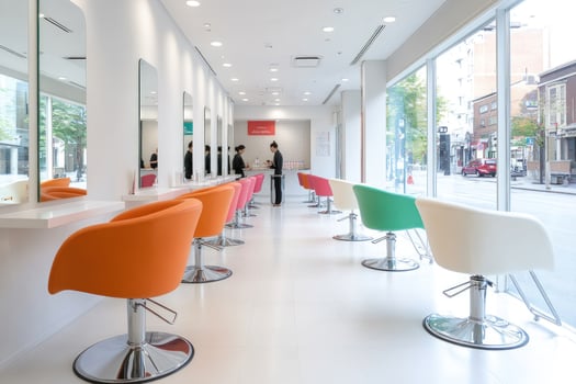 Modern hair salon interior with colorful chairs and large windows. photo