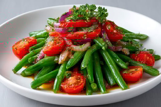 Green bean salad with cherry tomatoes, red onion and bell pepper on white plate photo