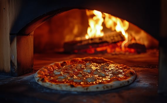 Freshly Baked Pizza in a Wood-Fired Oven Creating a Cozy Atmosphere. photo