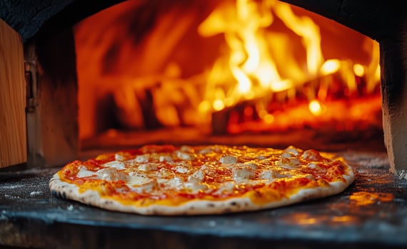 Freshly Baked Pizza in a Wood-Fired Oven Creating a Cozy Atmosphere photo