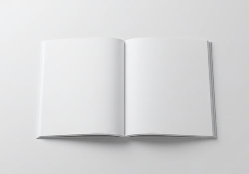 Open blank book with white pages on a white background, ready for content photo