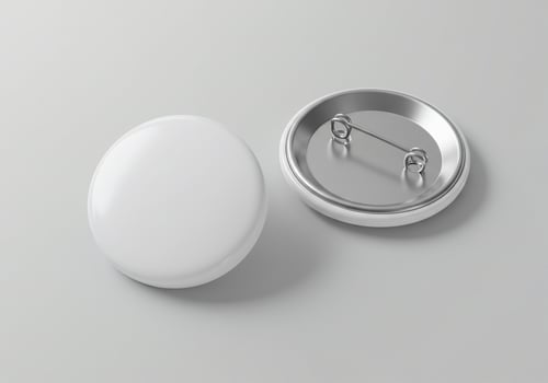 Two Blank White Circular Badges with Safety Pins photo