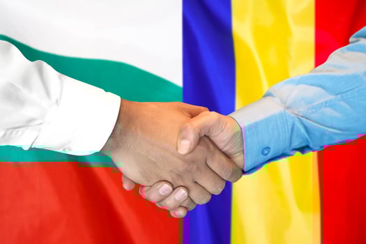 handshake on Bulgaria and Moldova flag background. photo