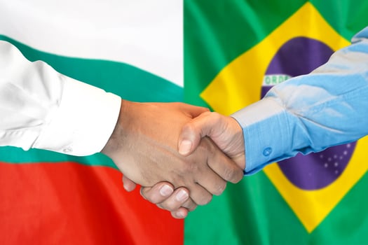 handshake on Bulgaria and Brazil flag background. photo