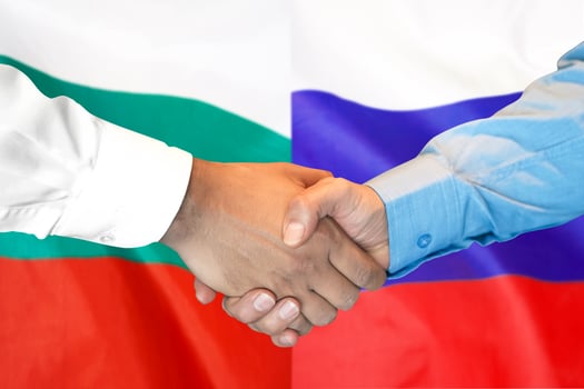 handshake on Bulgaria and Russia flag background. photo