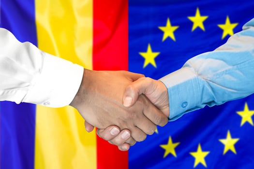 handshake on Moldova and European Union flag background. photo