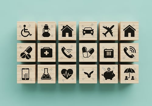 Collection of Insurance and Financial Protection Icons on Wooden Blocks photo