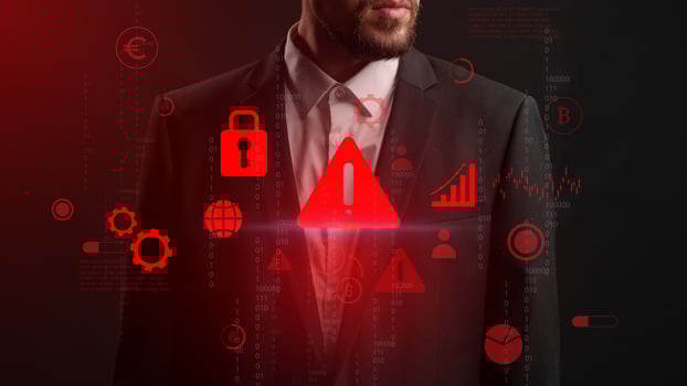 Business professional in a suit assessing cybersecurity threats with digital icons in a dark environment during a modern presentation photo