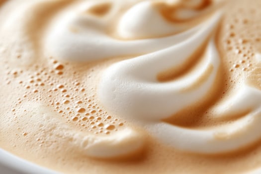 Closeup of a latte with a swirl of foam. photo