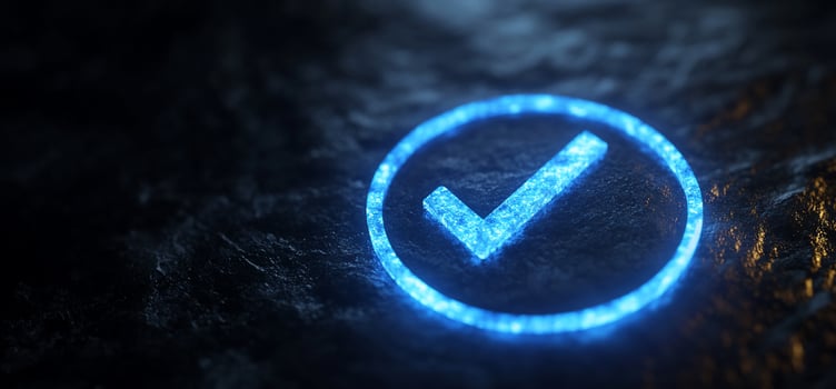 Glowing blue checkmark in a circle on a dark surface. photo