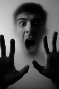 A man with his hands up in front of him photo