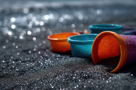 A colorful bucket on the beach photo