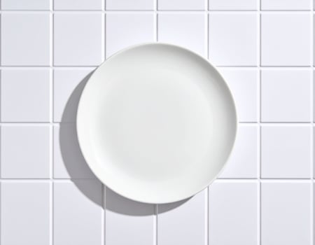 Empty White Plate on Tiles photo