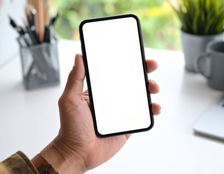 Hand holding smartphone with blank screen 56 photo