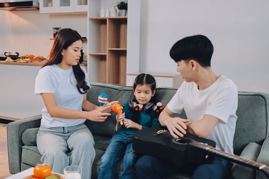Family playing music together at home photo