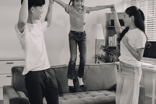 Family playing together in living room photo